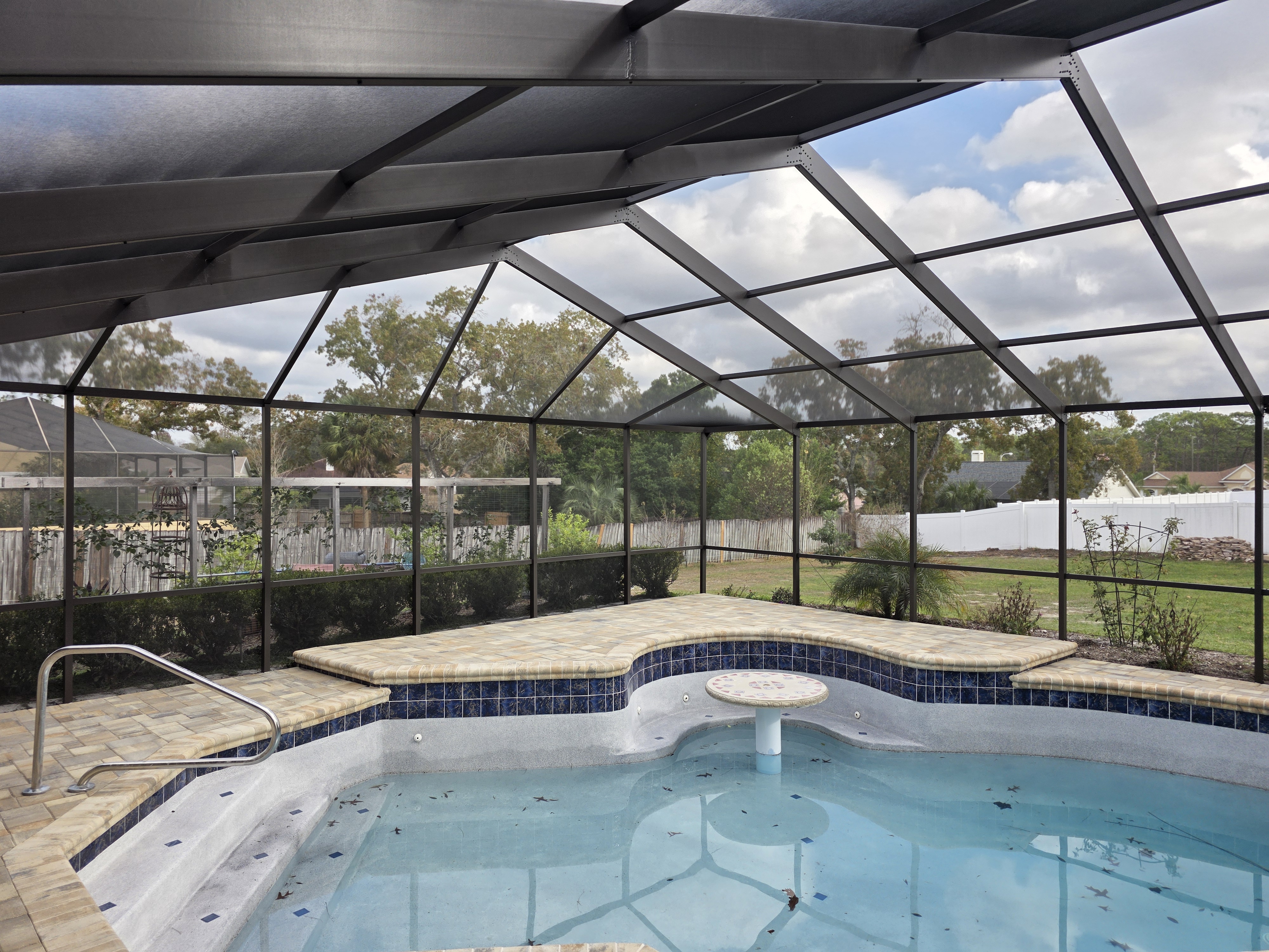 Screening Dunrite pool cage or lanai project photo — Building a Backyard Oasis: Pool, Lanai, Lighting, and Layout Together