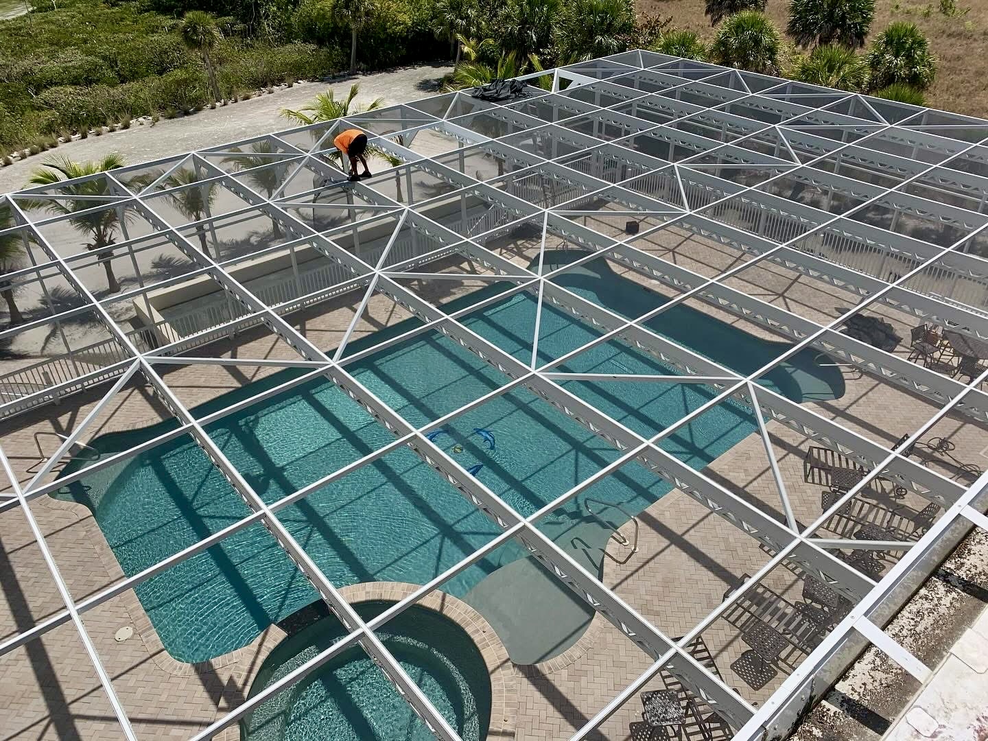 Screening Dunrite pool cage or lanai project photo — Pool Deck Safety: Slippery Spots, Drainage, and Screen Door Traffic
